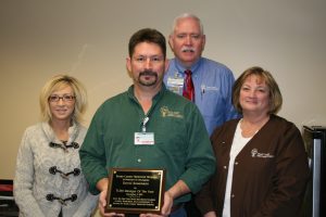 David Rosemann (front,center), Texas County Memorial Hospital 2013 manager of the year with (left to right), Linda Pamperien, chief financial officer; Wes Murray, chief executive officer, and Doretta Todd-Willis, chief nursing officer