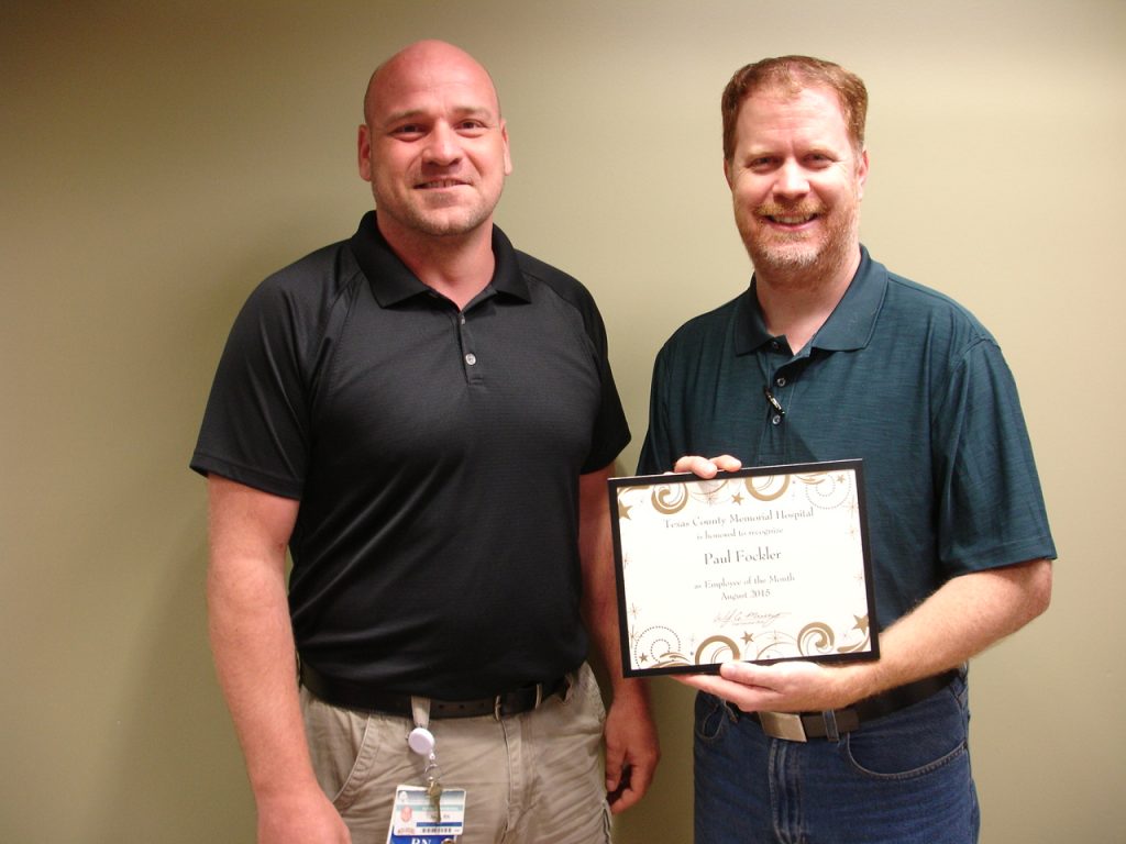 Paul Fockler (right), the Texas County Memorial Hospital August employee of the month, with his supervisor, John Sawyer.