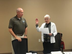 Texas County Memorial Hospital board of trustees chairperson, Dr. Jim Perry, OD (left), administered the oath of office to Omanez Fockler, returning board member at the meeting on Tuesday.