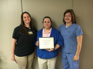 Christie Koch (center), Texas County Memorial Hospital March employee of the month, with Ellen Willis, physical therapy department director (far left) and Krista Elliott, Home Health of the Ozarks director.