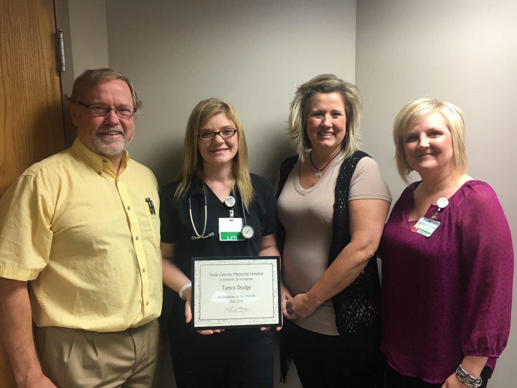 Tamra Dodge, an LPN in the TCMH Medical Complex in Houston, is the July employee of the month. Shown here are, left to right: Dr. William Wright; Dodge; Anita Kuhn, TCMH controller, and Hope Best, clinic manager.