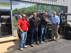 Making the donation from Mega Motorsports were, left to right, John Wells, Kelley Wake and Brandon Creech, with Jay Gentry, Healthcare Foundation director.