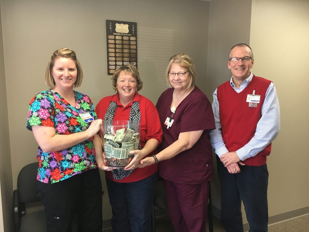 Shown here with the donation are (left to right), Courtney Owens, Hospice of Care director; Shari McCallister, D&L Florist owner, Sandy Eaton, Hospice nurse, and Jay Gentry, TCMH Healthcare Foundation director.